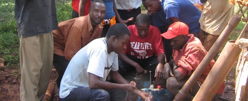 Living Water Development partners working on a well-drilling project