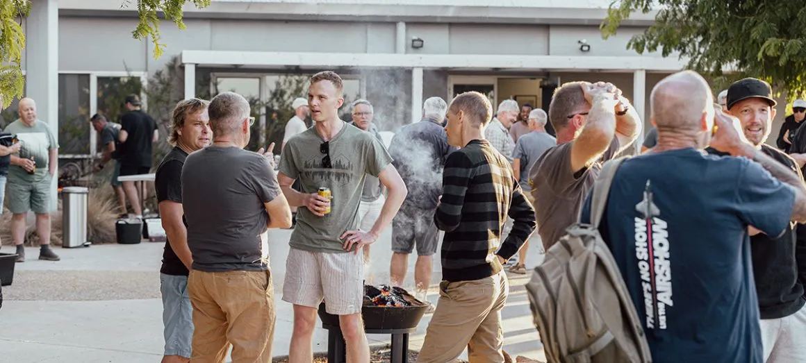 Men gathered around a table at OneHope